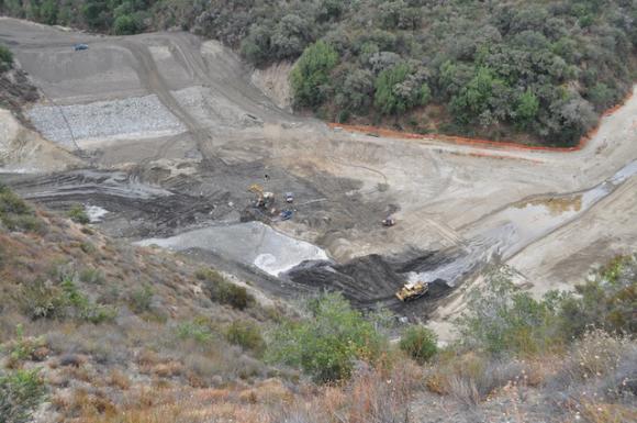 Heavy machinery rearranges the confluence of the Carmel River and San Clemente Creek on Aug. 7, 2015.