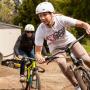 Brittany Bolen (in white) and friend at a Shine Riders pump track clinic. Photo by Clay Ryon.