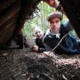 Pretty cozy. A correctly built debris shelter will keep a person dry and warm enough not to freeze.
