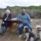 Alex Conway, left, and Gilbert sit with their dogs at Manresa Uplands State Beach--a favorite walking spot for the couple — so much that Conway dedicated a Tribute Table to commemorate their relationship. Photo: FOSCSP