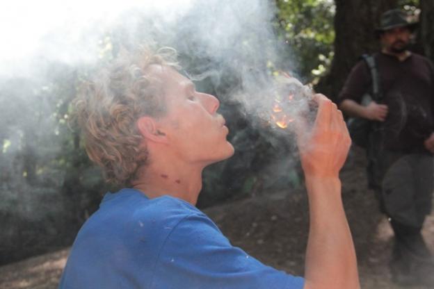 Wilderness survival instructor Jack Harrison coaxes a flame from a ball of tinder during an Adventure Out class in early April.