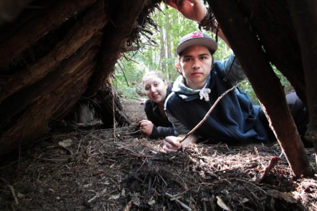 Pretty cozy. A correctly built debris shelter will keep a person dry and warm enough not to freeze.