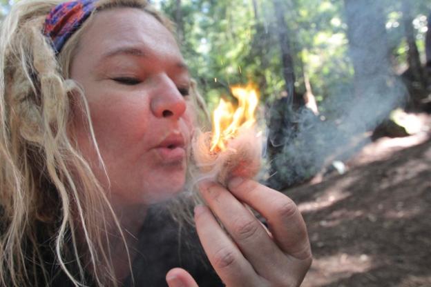 A student gets the holy grail of an Adventure Out wilderness survival class: fire.