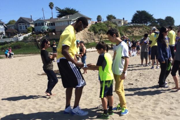 After the heavy lifting comes the care and feeding of fans. A Warriors player signs autographs at the March 15 Seabright beach cleanup. Photo by Alexa Lomberg. After the heavy lifting comes the care and feeding of fans. A Warriors player signs autographs at the March 15 Seabright beach cleanup. Photo by Alexa Lomberg.