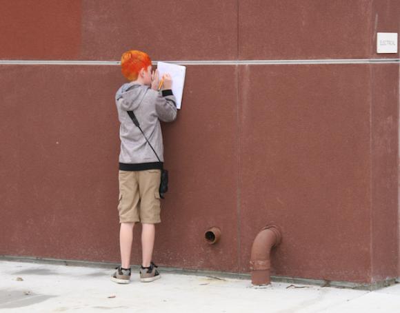 An SLV Middle School student records his observations for Bird School.