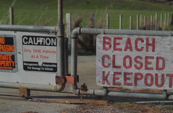 The gate to Martins Beach is still locked, despite last week's court order to open it. Image from "Martin's 5: Battle for the Beach,' by The Inertia. (See video below.)