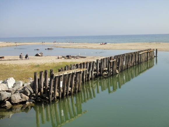 Aptos Creek meets the Pacific Ocean at Rio Del Mar, sometimes creating a summertime lagoon. Photo by Garrett McAuliffe.